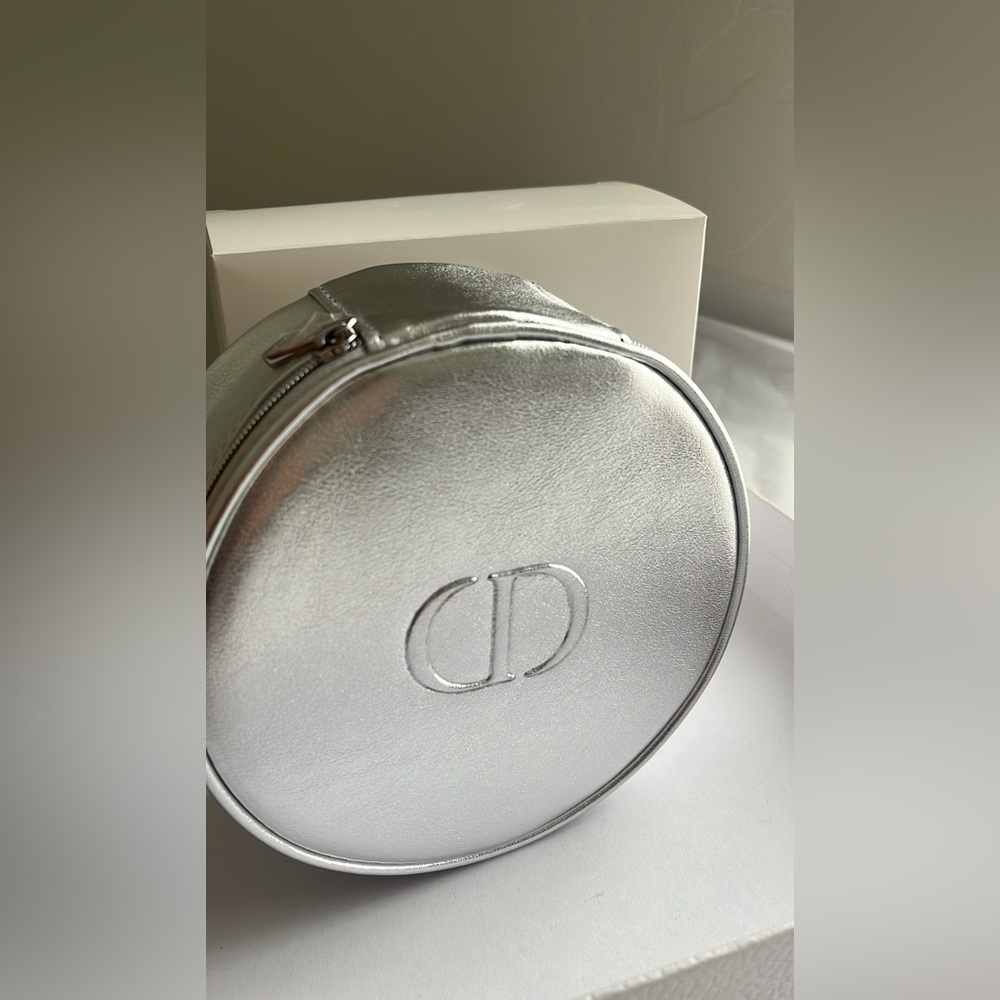 New, authentic Dior round silver case. Limited edition